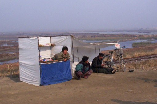 A snack kiosk and bicycle repairing station in Ryonggang county near Nampo